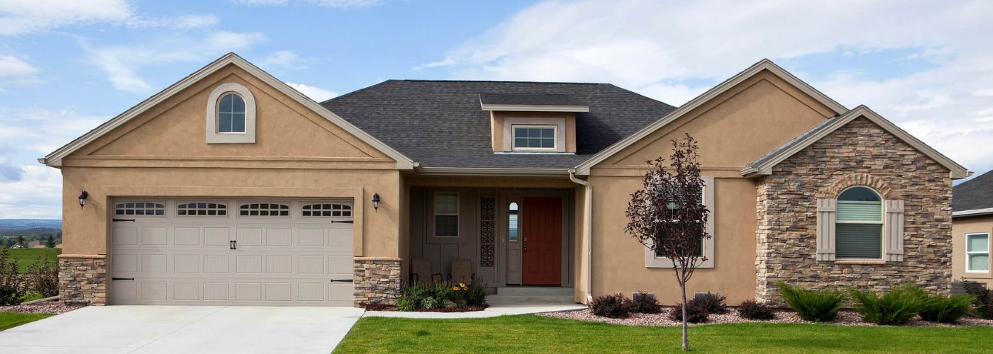 Nice, newer stucco and stone ranch-style home.